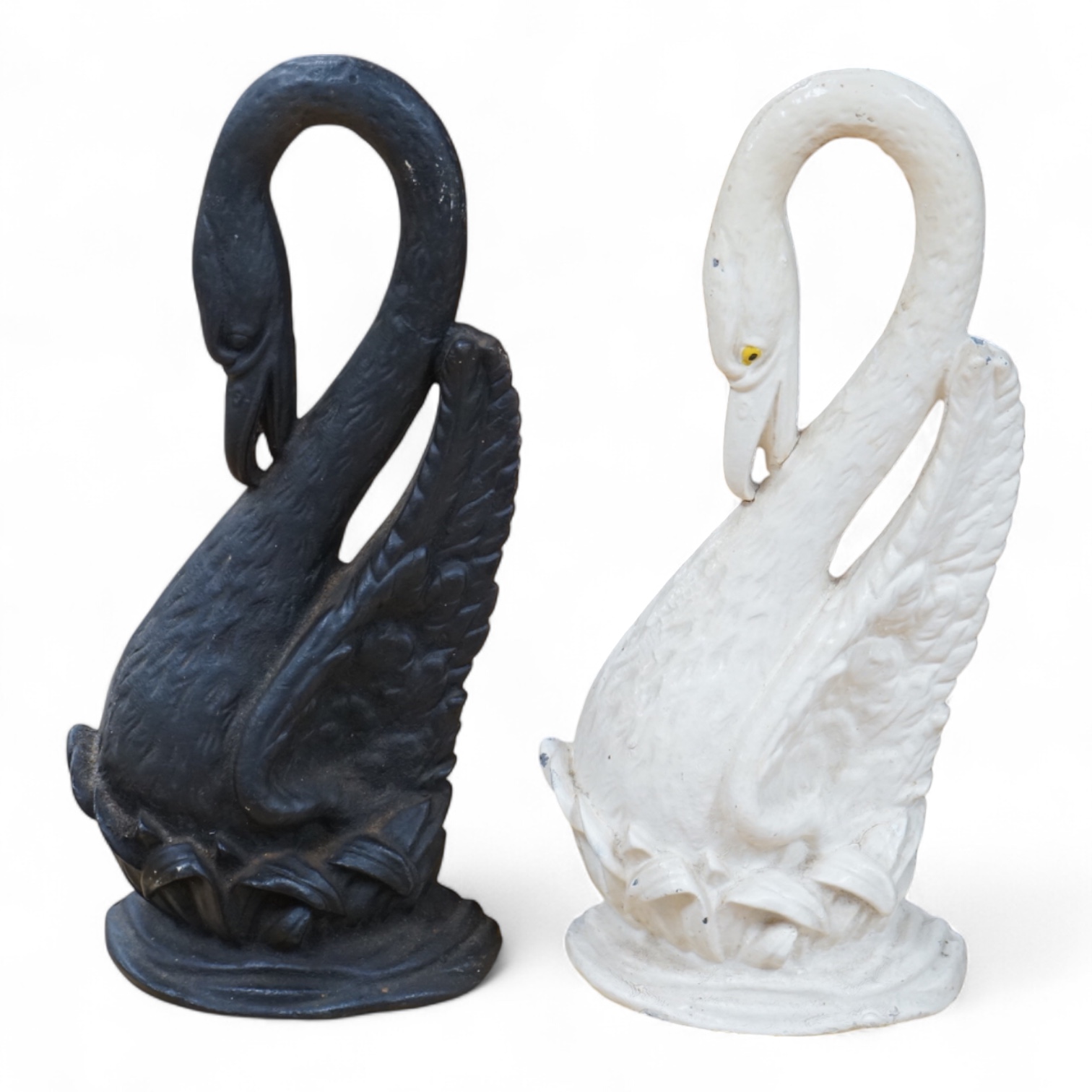 Two Victorian cast iron ‘swan’ door stops, one painted, 38cm